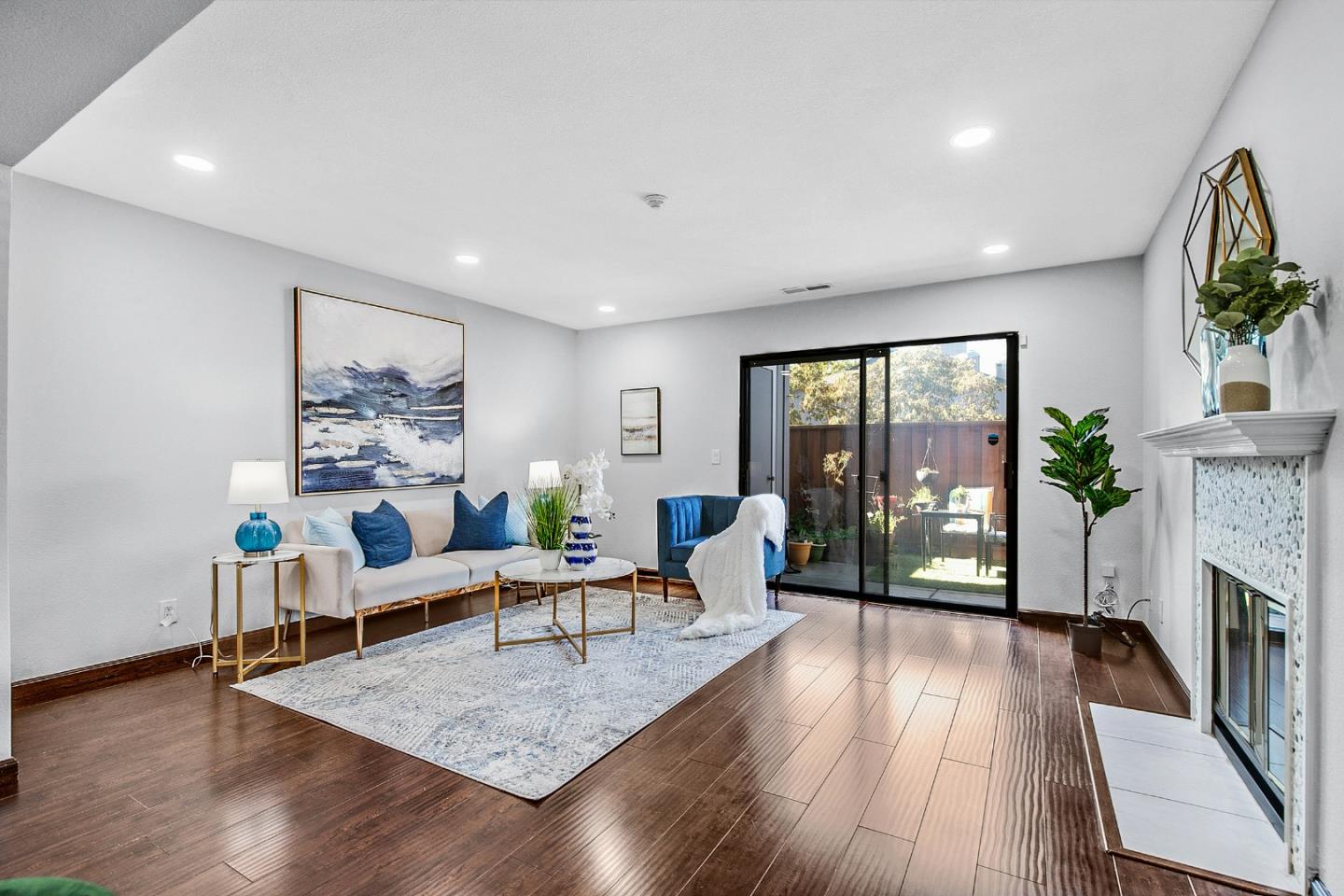 36913 Newark Boulevard, Unit A Newark, CA 94560 - Photo 2 of 20 a living room with fireplace furniture and a wooden floor