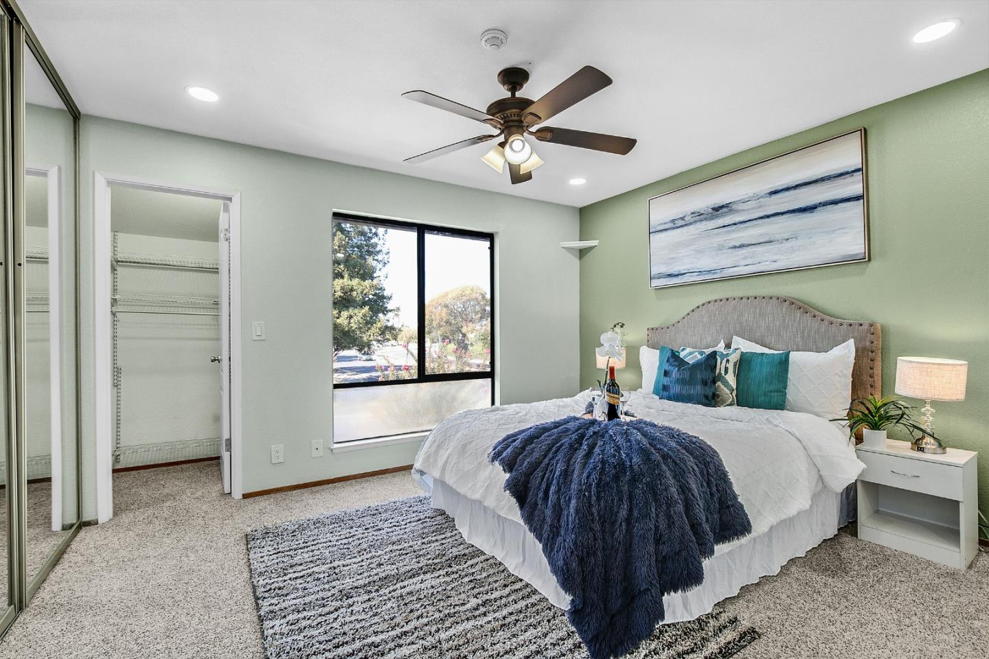 36913 Newark Boulevard, Unit A Newark, CA 94560 - Photo 7 of 20 a bedroom with a large bed and a chandelier