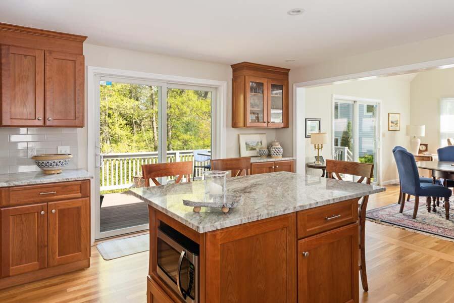 6 Wading Place Road Mashpee, MA 02649 - Photo 11 of 35 a dining hall with stainless steel appliances granite countertop a sink and a large window