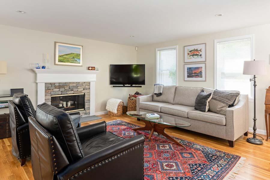 6 Wading Place Road Mashpee, MA 02649 - Photo 17 of 35 a living room with furniture and a fireplace