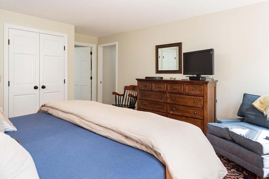 6 Wading Place Road Mashpee, MA 02649 - Photo 20 of 35 a bedroom with a bed and a television