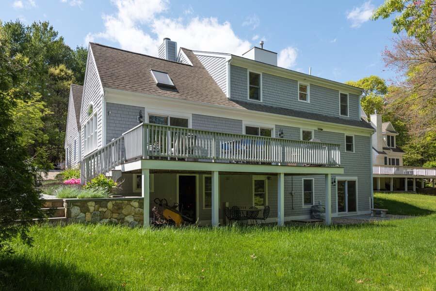 6 Wading Place Road Mashpee, MA 02649 - Photo 4 of 35 a view of an house with backyard space and garden