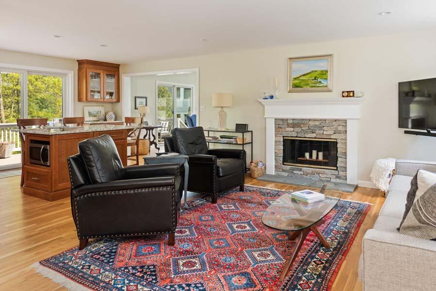 6 Wading Place Road Mashpee, MA 02649 - Photo 8 of 35 a living room with furniture and a fireplace