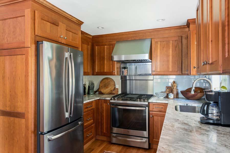 6 Wading Place Road Mashpee, MA 02649 - Photo 10 of 35 a kitchen with stainless steel appliances granite countertop a refrigerator stove and sink