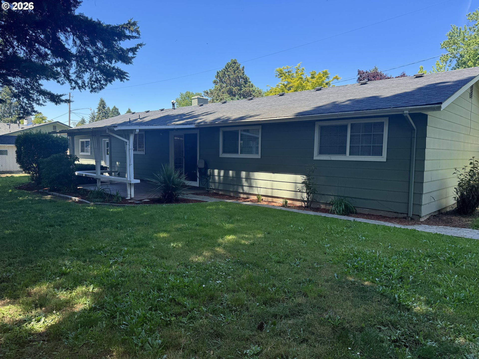260 Susan Street Eugene, OR 97404 - Photo 26 of 33 a view of a house with a yard and sitting area