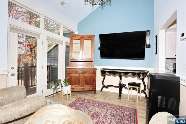 an aerial view of a house with swimming pool and garden