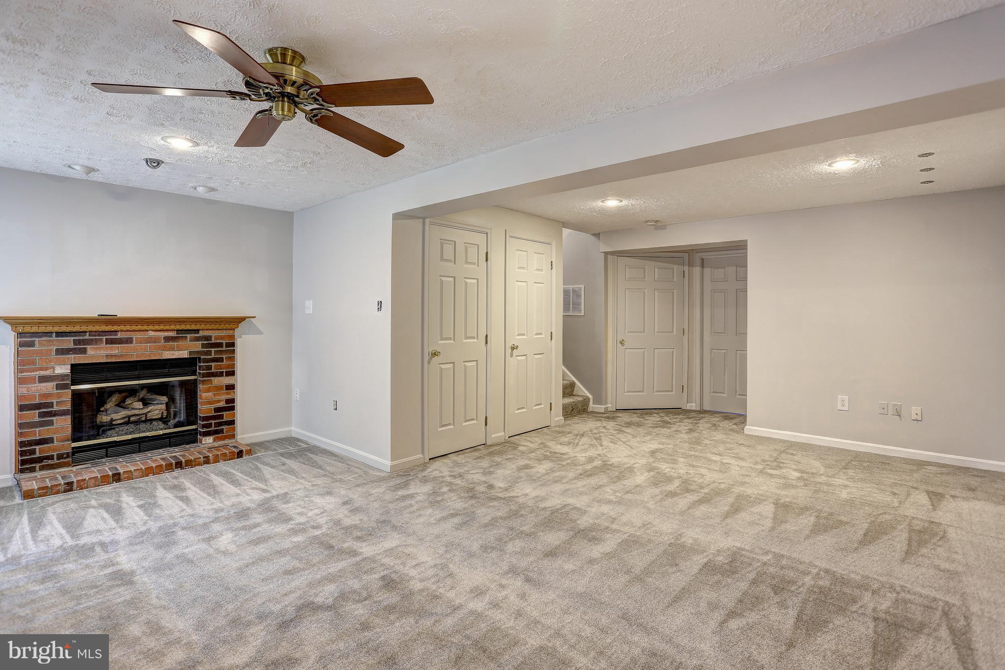 2484 Warm Spring Way Odenton, MD 21113 - Photo 24 of 40 Cozy fireplace in basement