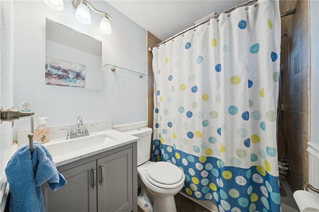 588 Carmelott Street Irwin, PA 15642 - Photo 12 of 33 a bathroom with a sink toilet and shower