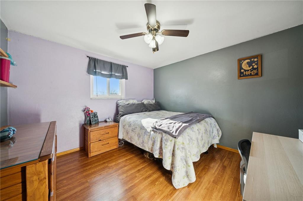 588 Carmelott Street Irwin, PA 15642 - Photo 17 of 33 a bedroom with a bed and a potted plant