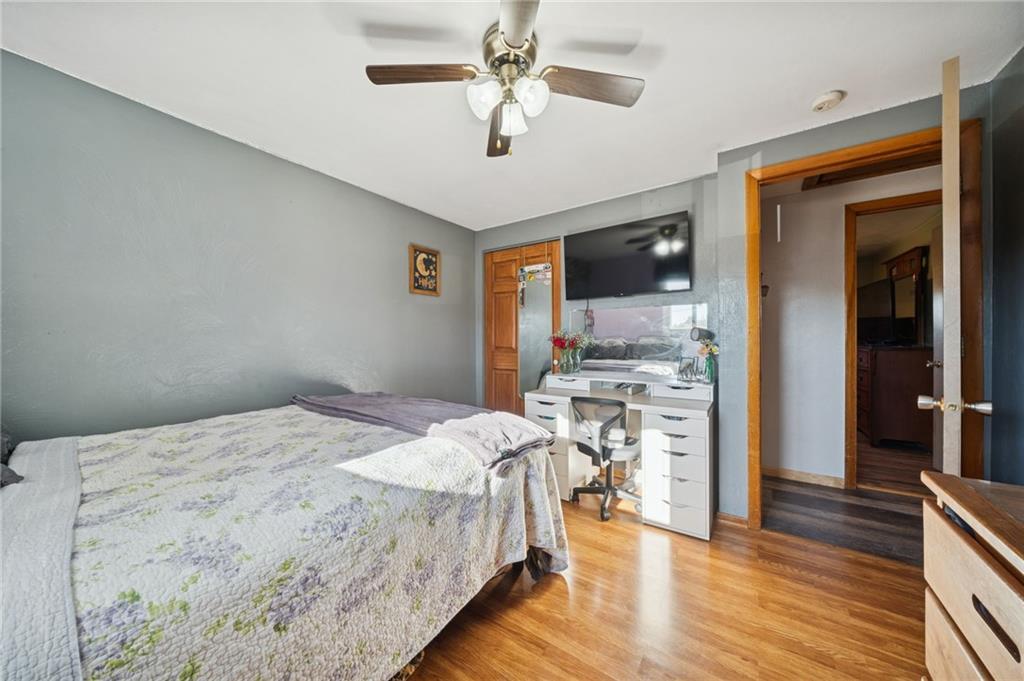 588 Carmelott Street Irwin, PA 15642 - Photo 18 of 33 a bed room with a bed and a television