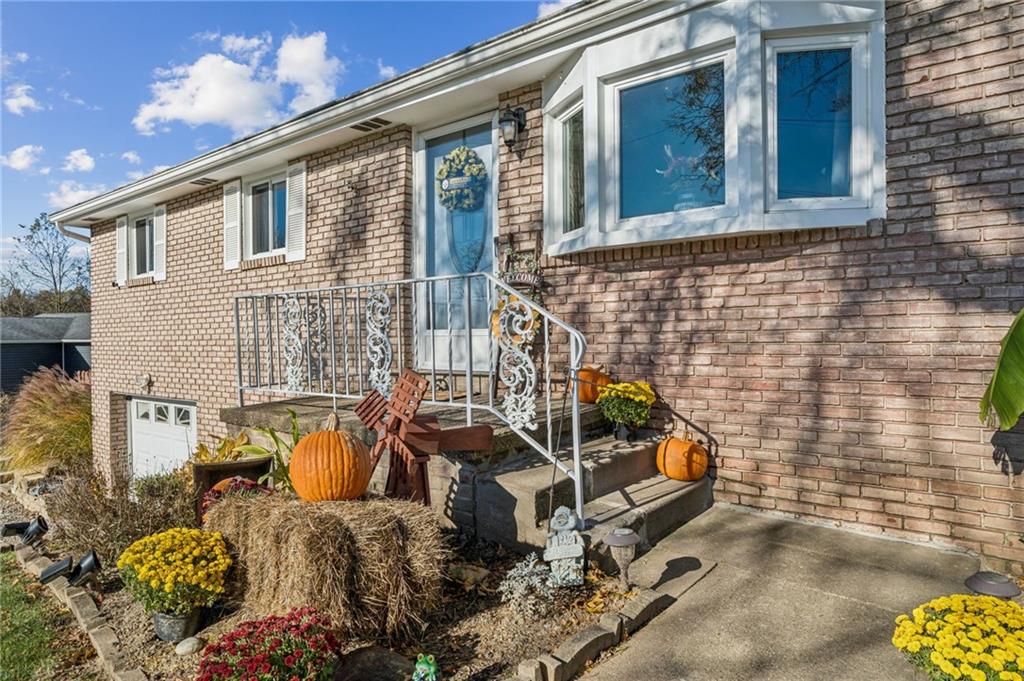 588 Carmelott Street Irwin, PA 15642 - Photo 2 of 33 a front view of a house with outdoor seating