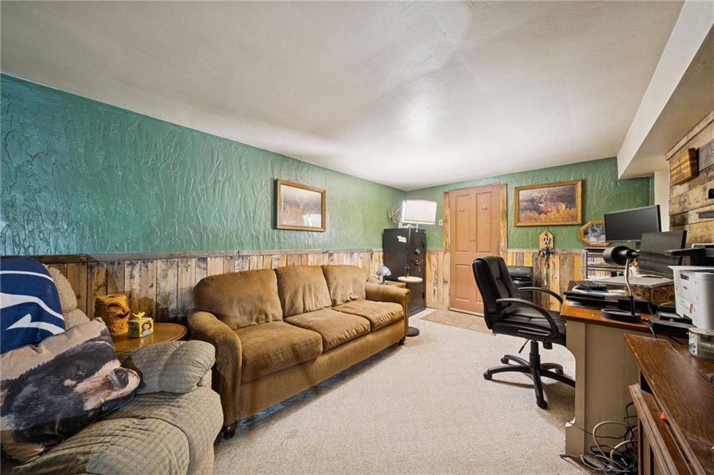 588 Carmelott Street Irwin, PA 15642 - Photo 24 of 33 a living room with furniture and a flat screen tv