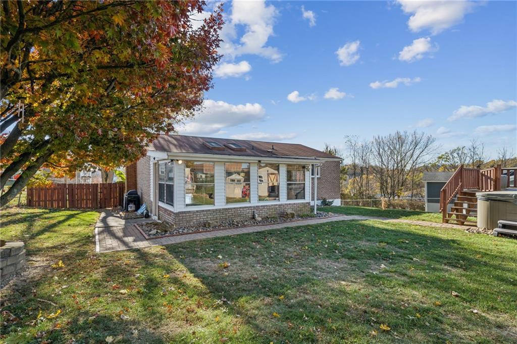 588 Carmelott Street Irwin, PA 15642 - Photo 27 of 33 a view of a house with a big yard and large trees