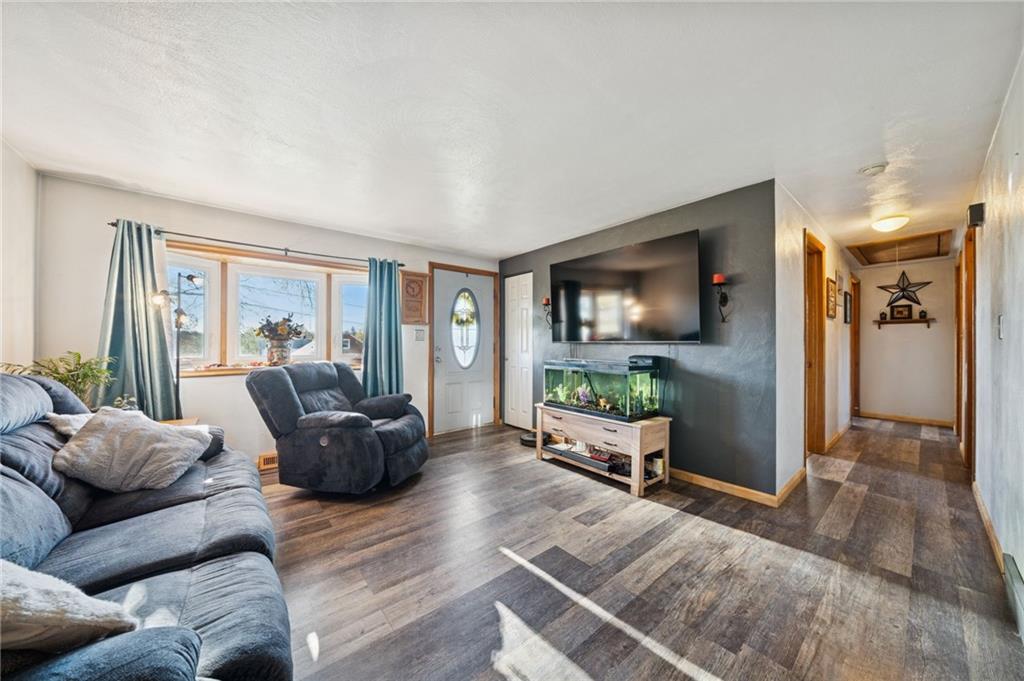 588 Carmelott Street Irwin, PA 15642 - Photo 4 of 33 a living room with furniture and a flat screen tv