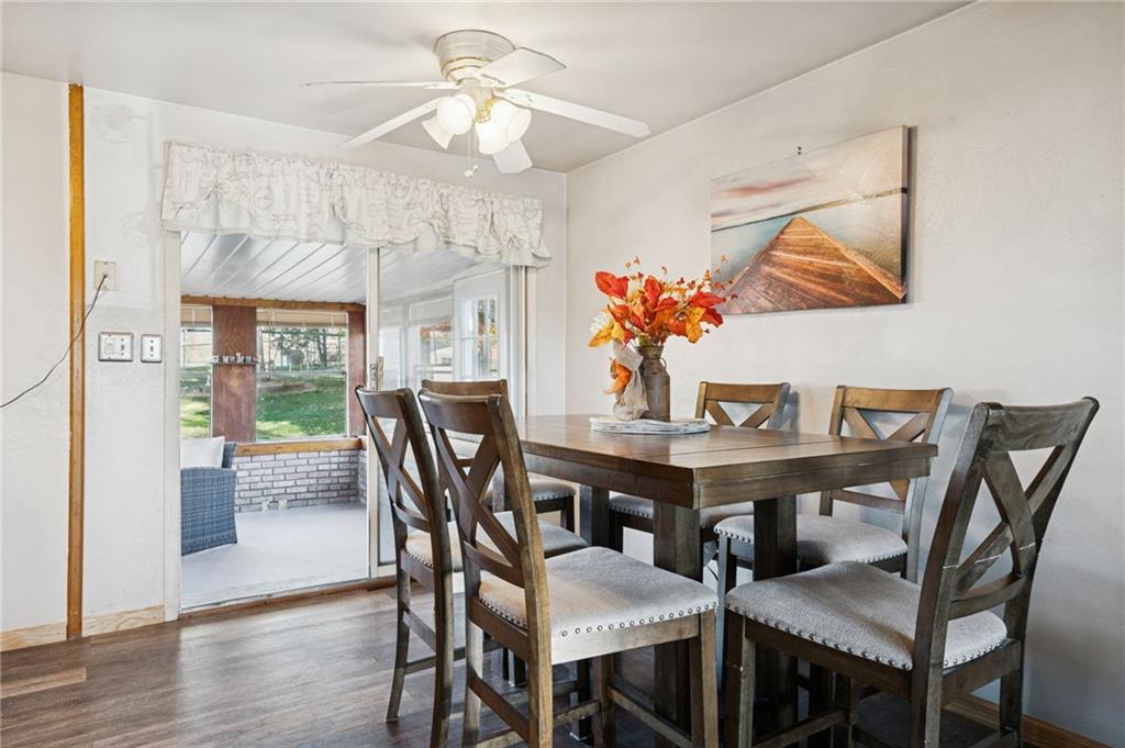 588 Carmelott Street Irwin, PA 15642 - Photo 9 of 33 a view of a dining room with furniture a chandelier and wooden floor