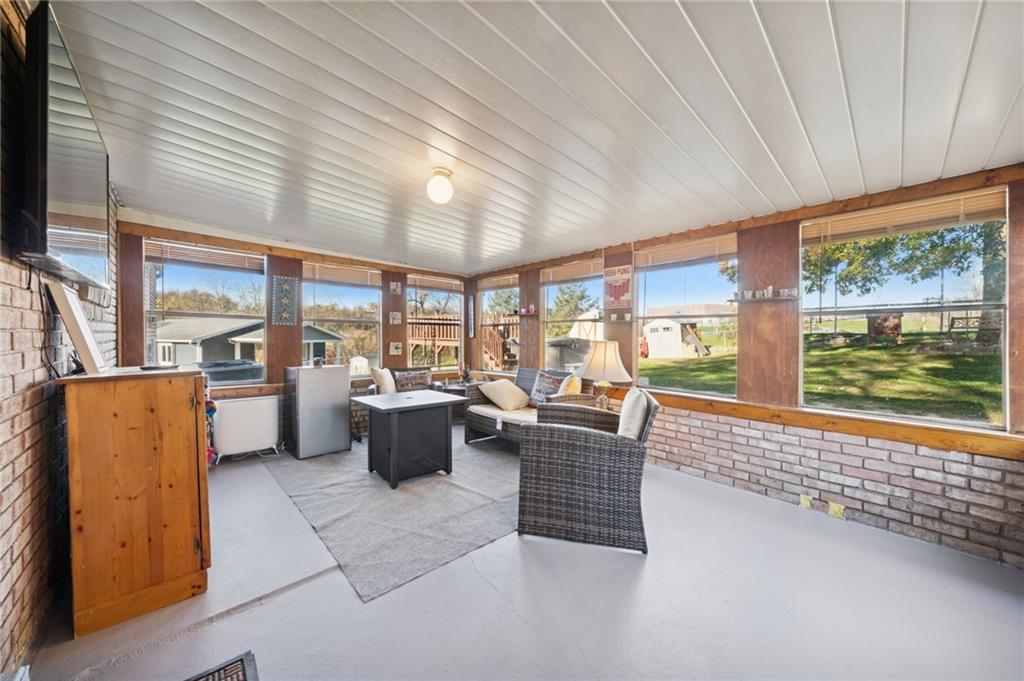 588 Carmelott Street Irwin, PA 15642 - Photo 10 of 33 a living room with furniture and a flat screen tv