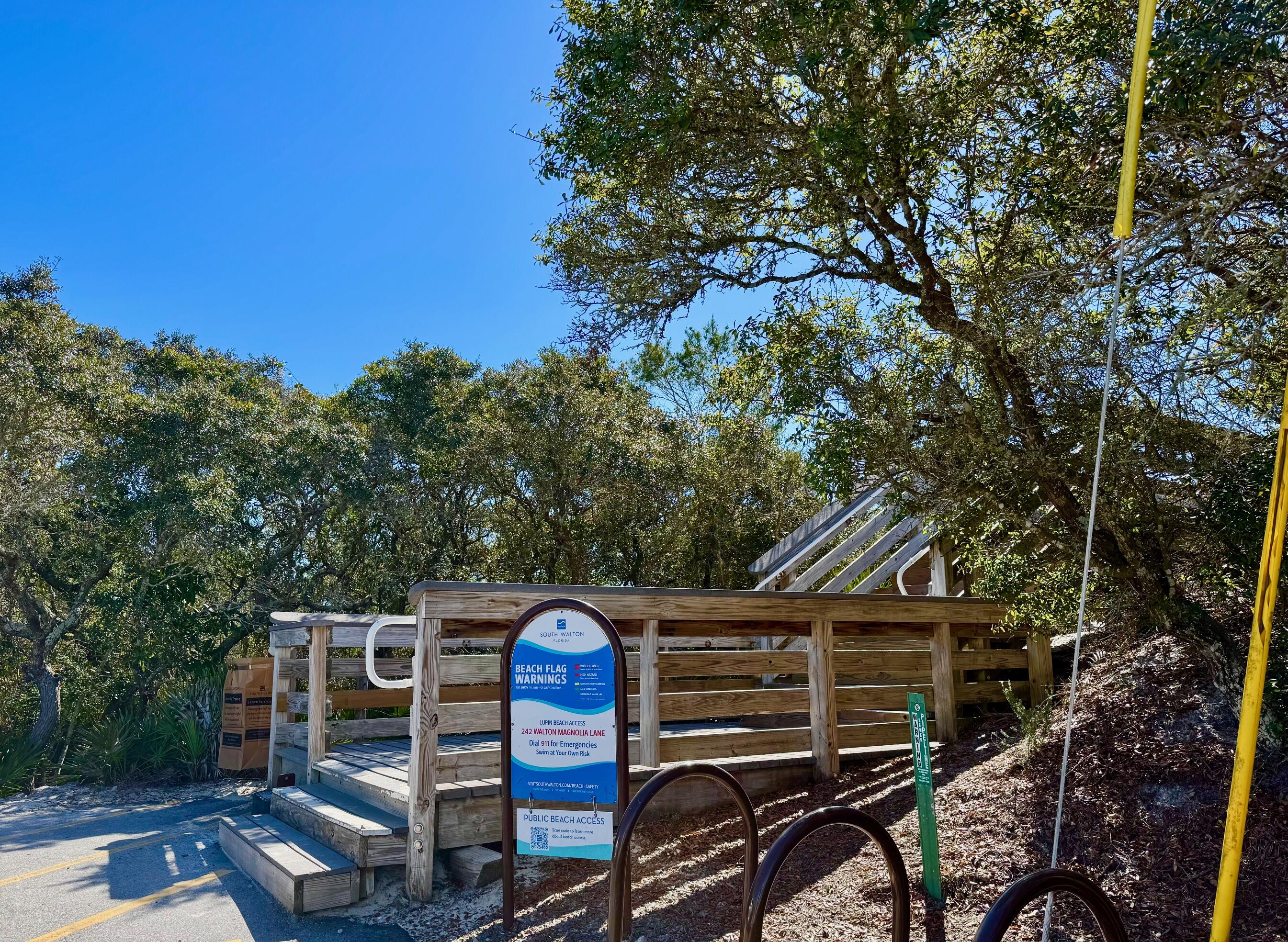 228 Walton Magnolia Lane, Unit 9 Inlet Beach, FL 32461 - Photo 19 of 24 a view of a chairs and tables in the backyard