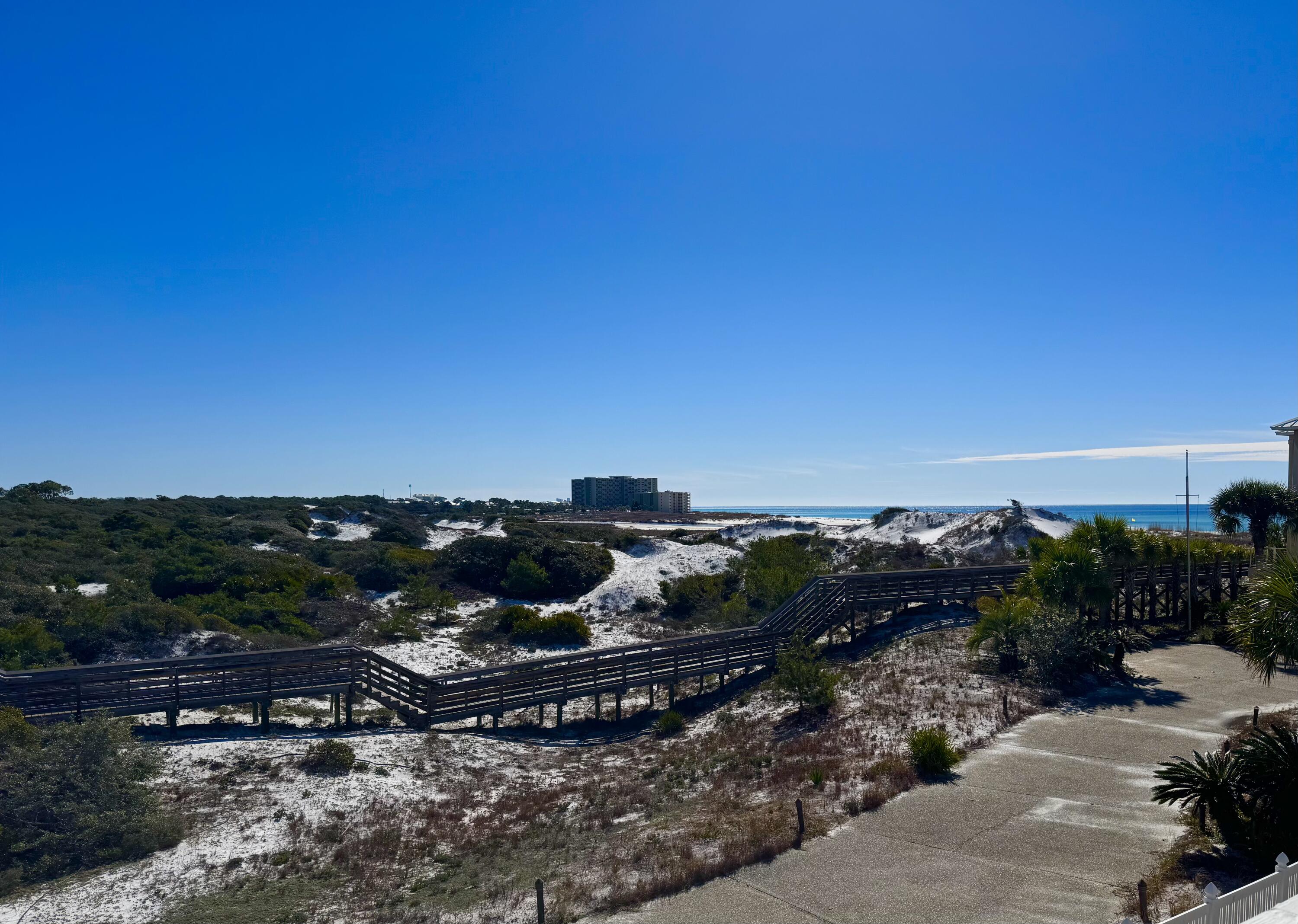 228 Walton Magnolia Lane, Unit 9 Inlet Beach, FL 32461 - Photo 2 of 24 a view of a lake with houses