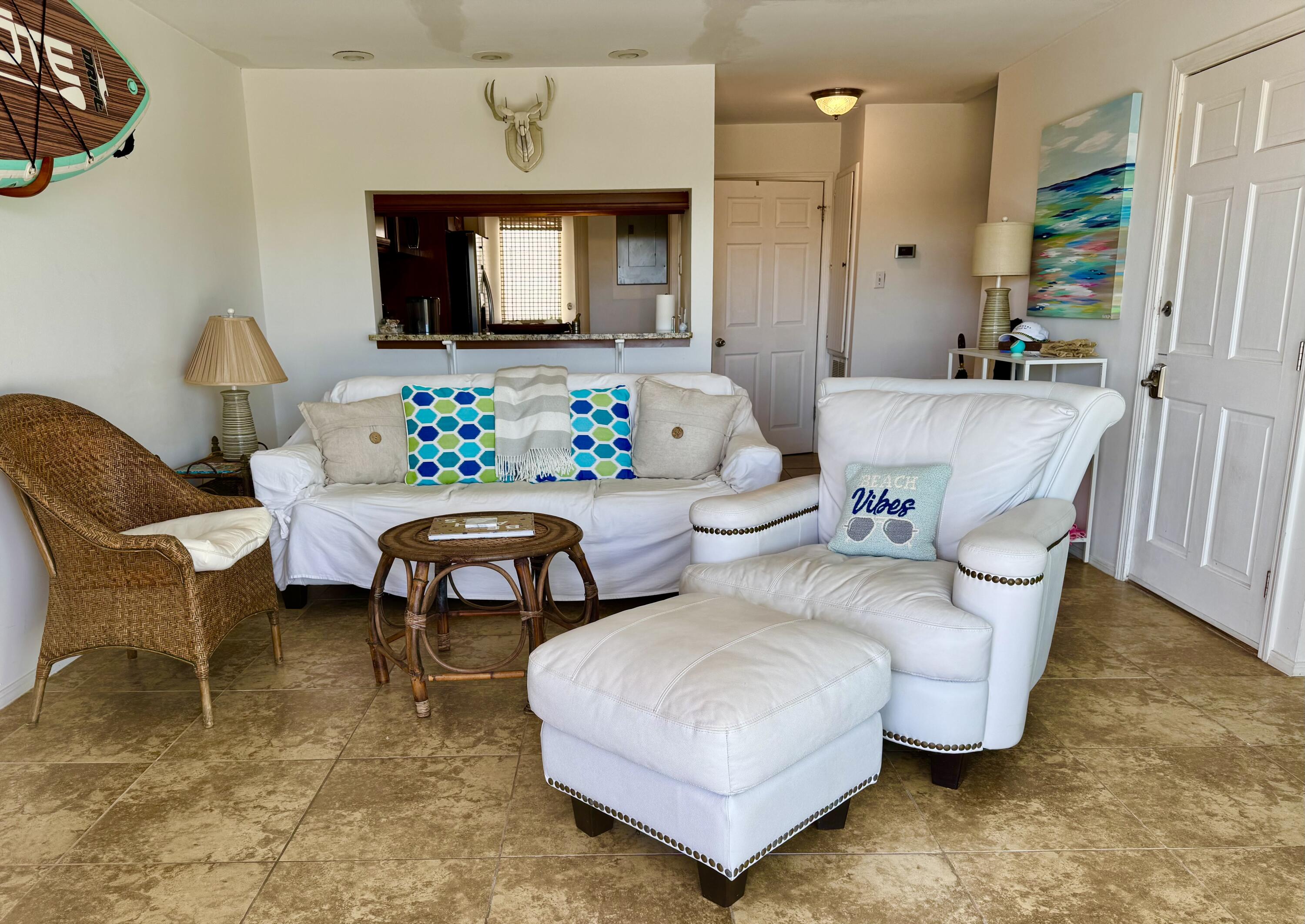 228 Walton Magnolia Lane, Unit 9 Inlet Beach, FL 32461 - Photo 3 of 24 a living room with furniture and a flat screen tv
