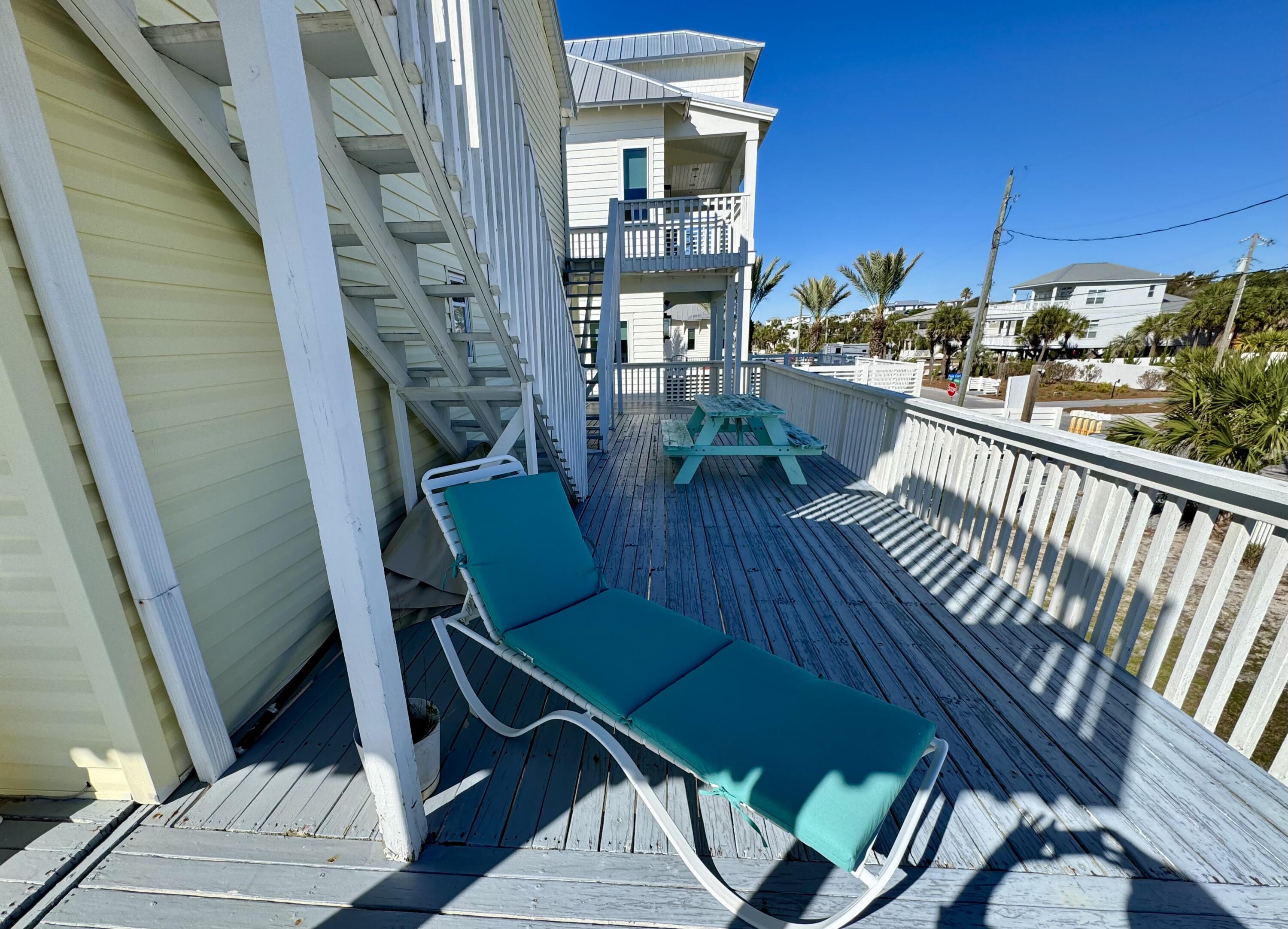228 Walton Magnolia Lane, Unit 9 Inlet Beach, FL 32461 - Photo 10 of 24 a view of balcony with a dining space and a potted plant