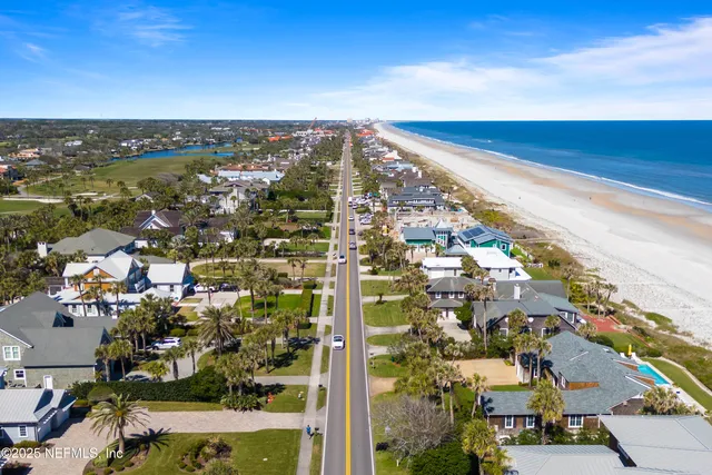 a view of a houses with swimming pool and lake view