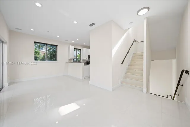 a view of a hallway with an entryway