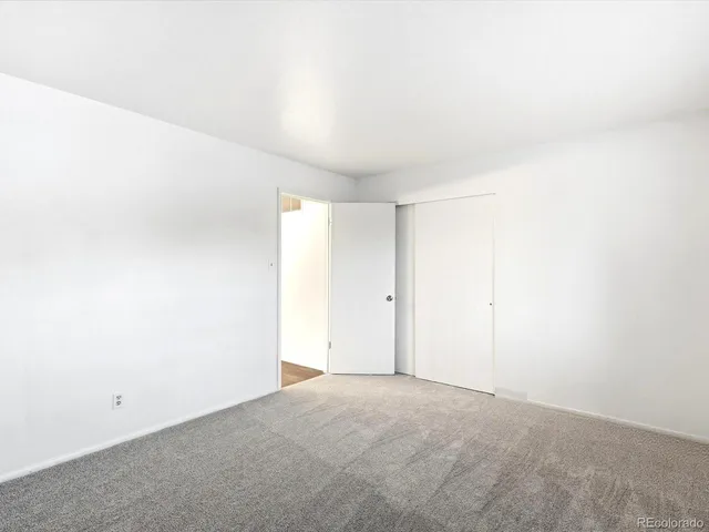 a kitchen with kitchen island a sink stainless steel appliances and cabinets