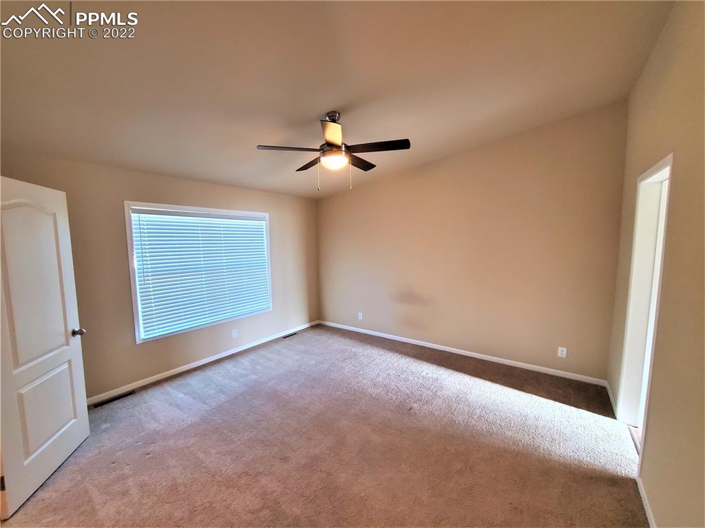 940 Sengbeil Road Yoder, CO 80864 - Photo 7 of 19 a view of an empty room with a window