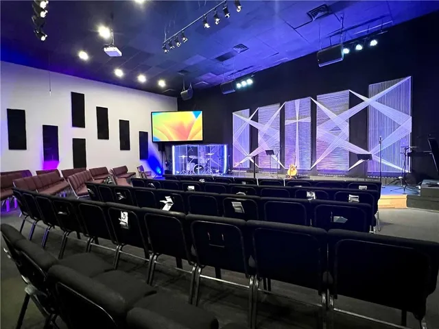 a view of a room with furniture and a flat screen tv