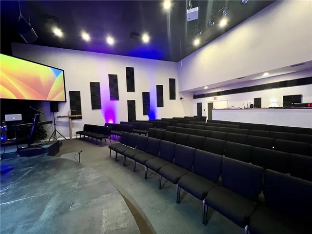 a large room with lots of gym equipment