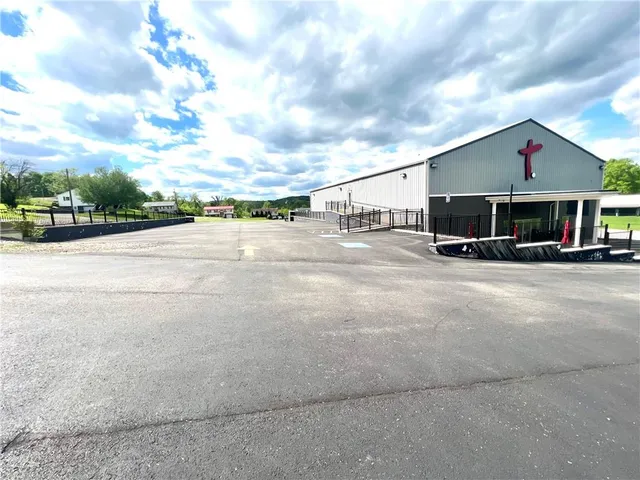 a view of house next to a yard