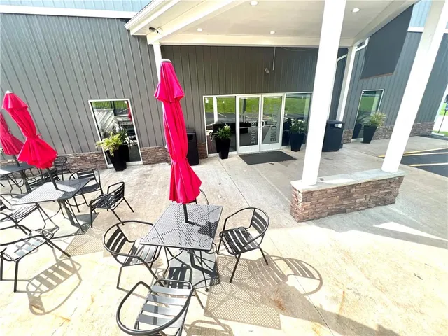 a view of a swimming pool with a lounge chair