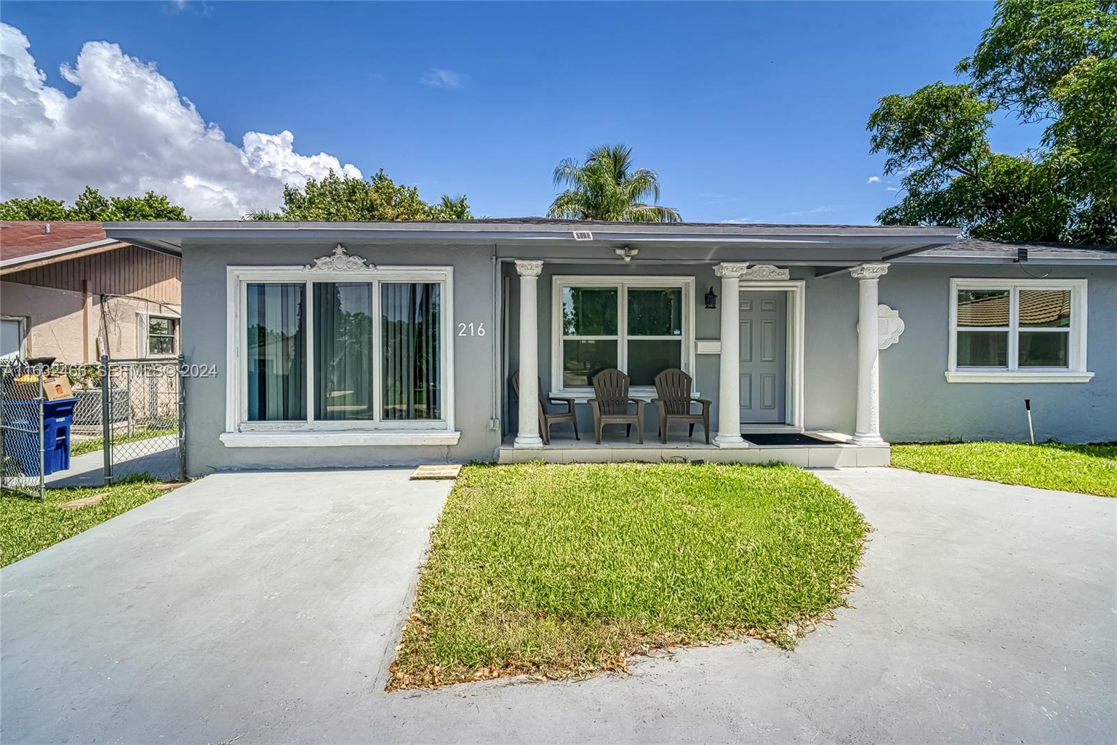 216 Southwest 6th Street Hallandale Beach, FL 33009 - Photo 1 of 70 front view of a house with a yard