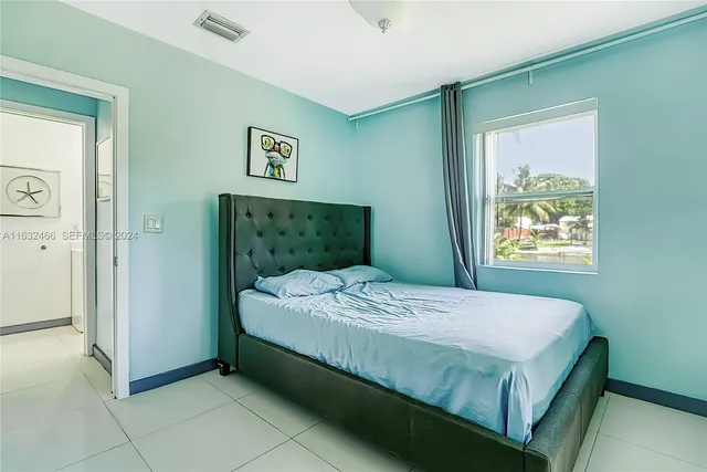 a close view of a faucet a sink a window and a mirror