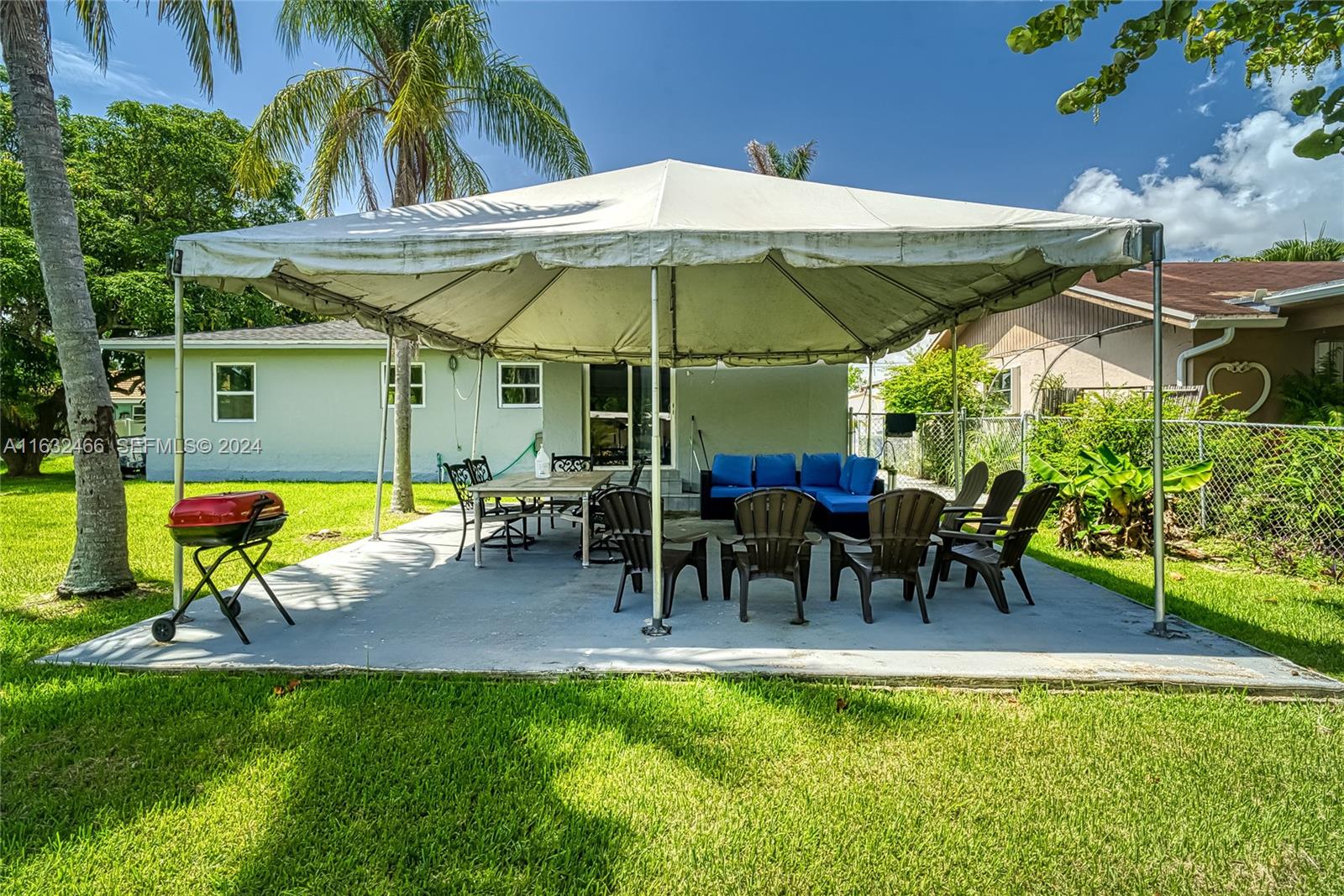 216 Southwest 6th Street Hallandale Beach, FL 33009 - Photo 38 of 70 a view of a backyard with a patio and swimming pool