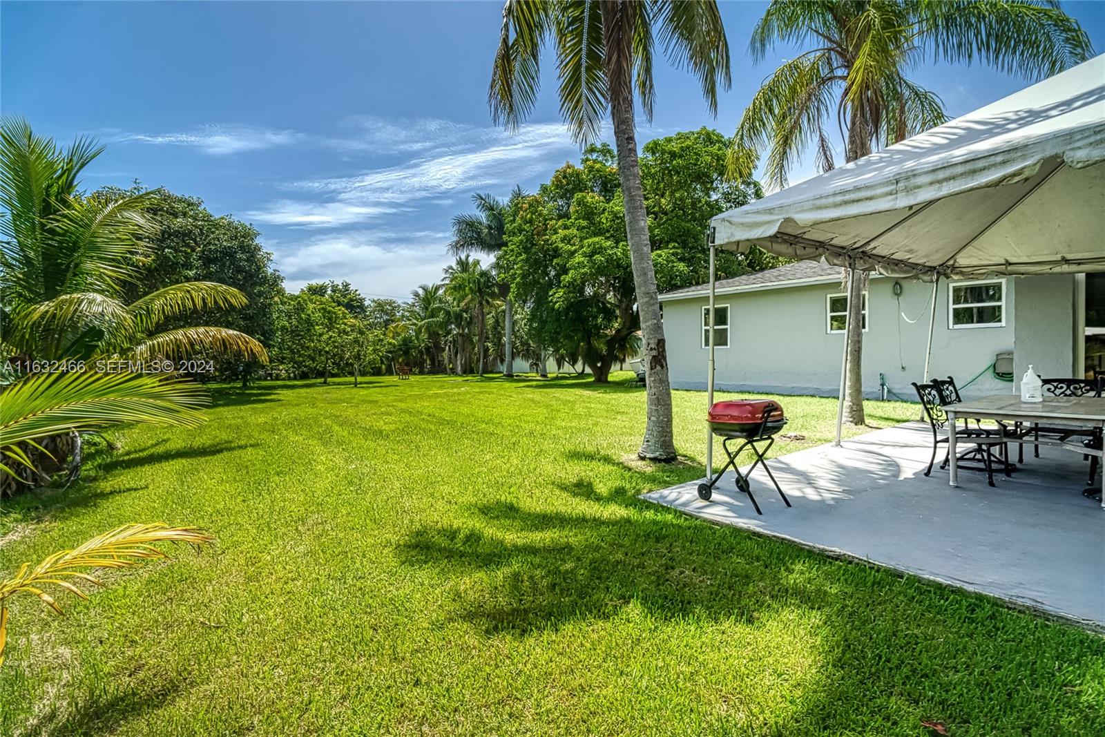 216 Southwest 6th Street Hallandale Beach, FL 33009 - Photo 41 of 70 a view of a house with a backyard porch and sitting area