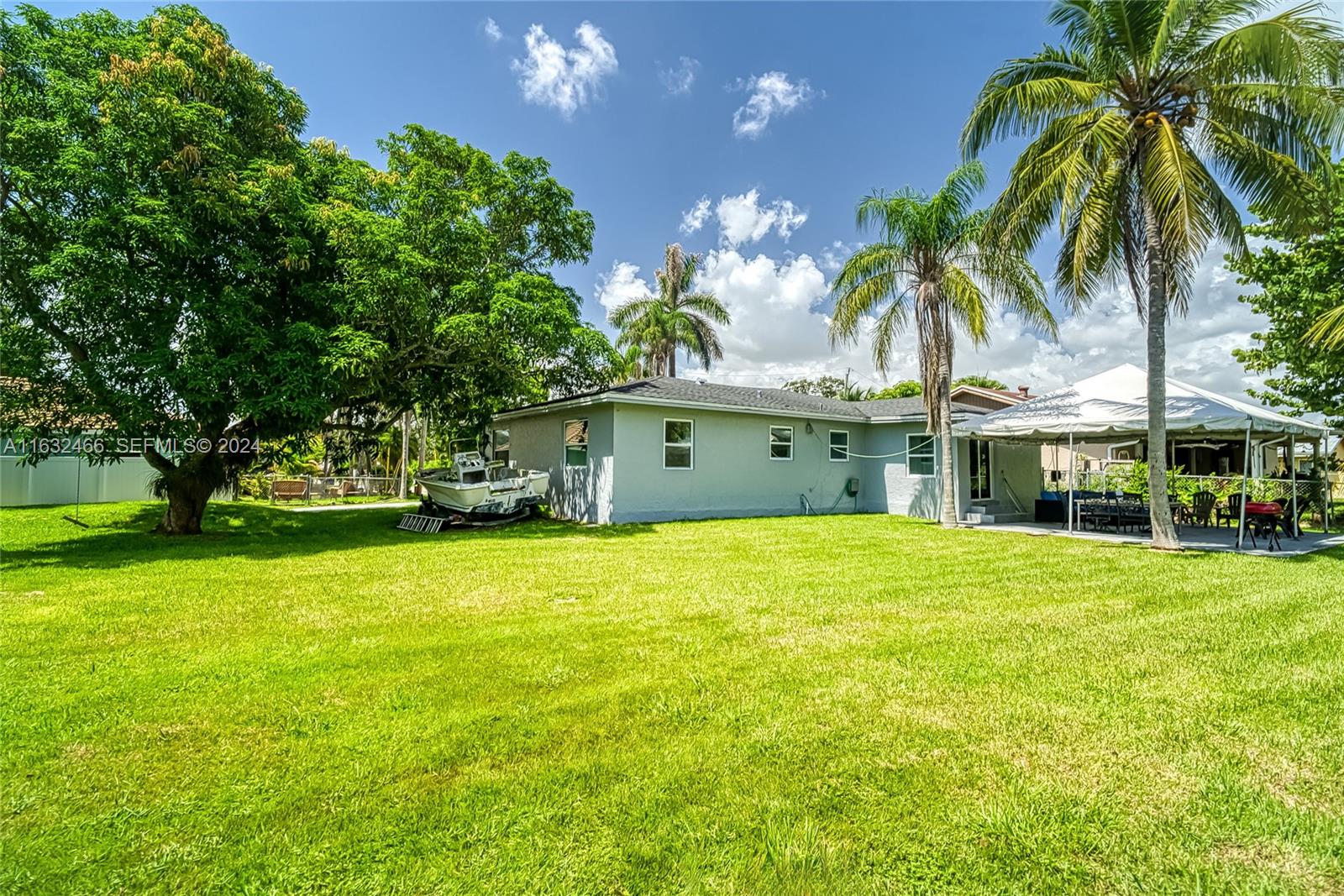216 Southwest 6th Street Hallandale Beach, FL 33009 - Photo 48 of 70 a view of a house with a garden and swimming pool