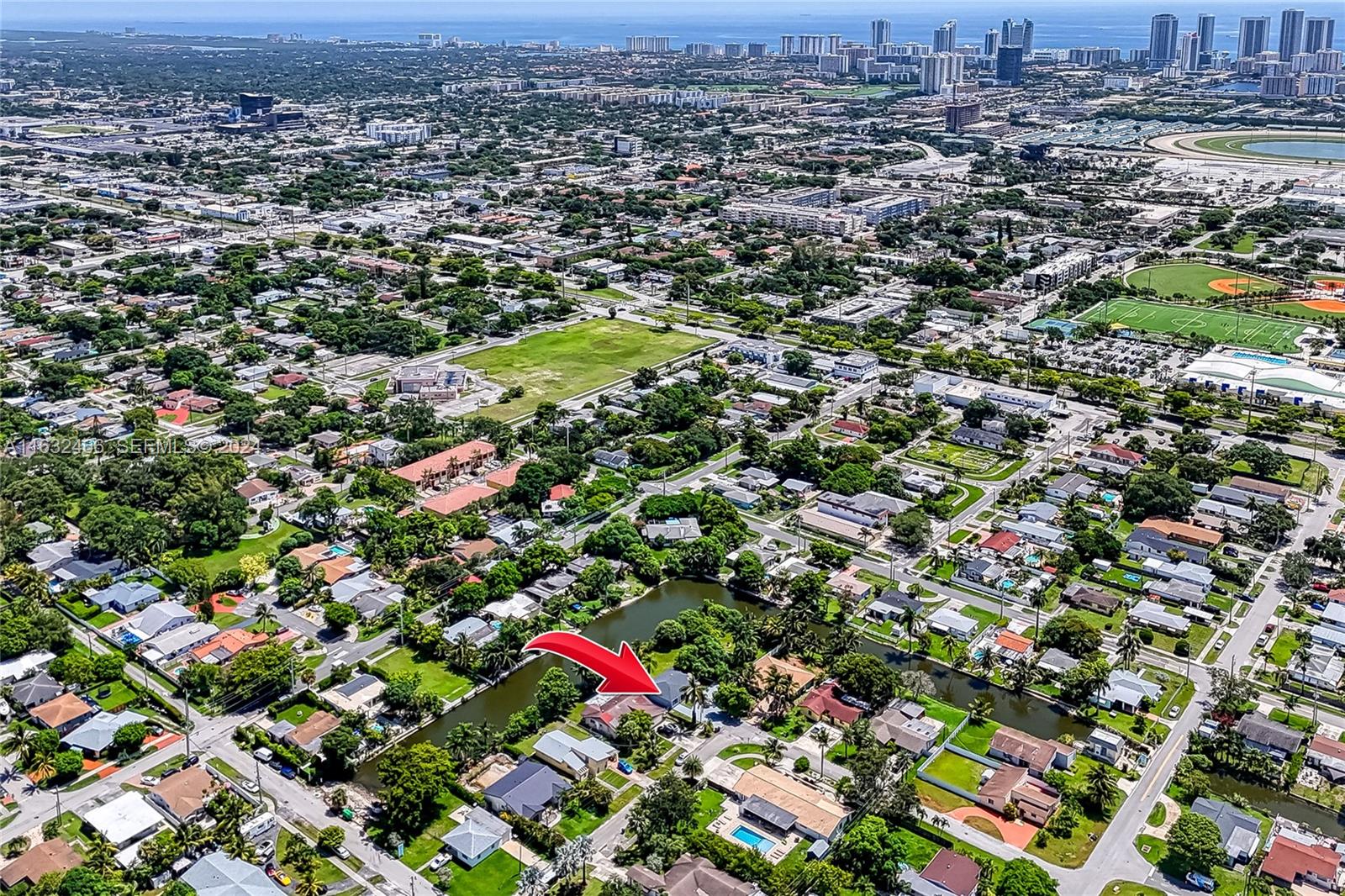 216 Southwest 6th Street Hallandale Beach, FL 33009 - Photo 55 of 70 an aerial view of residential houses with outdoor space and trees