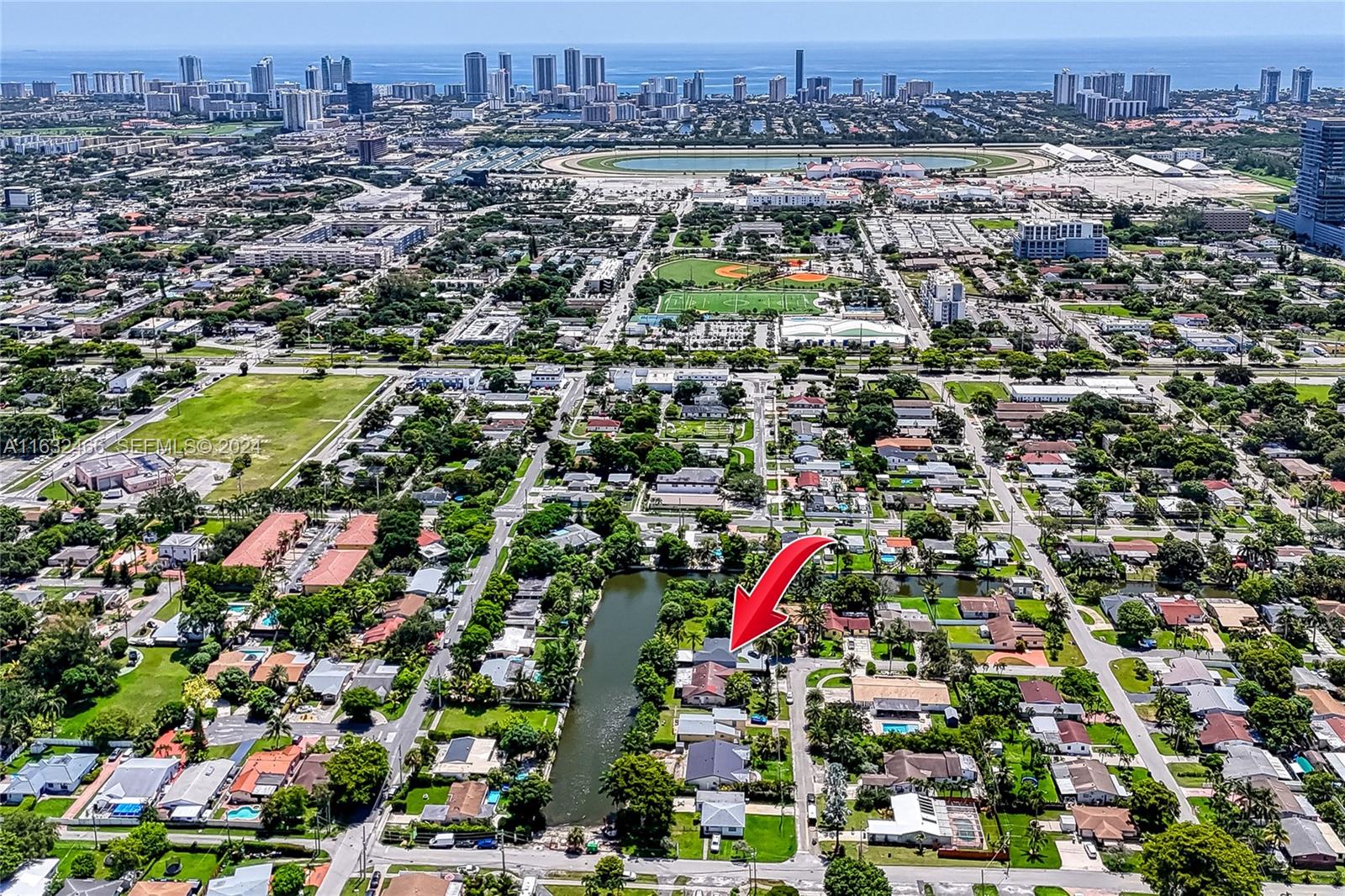 216 Southwest 6th Street Hallandale Beach, FL 33009 - Photo 56 of 70 an aerial view of residential houses with city and ocean view
