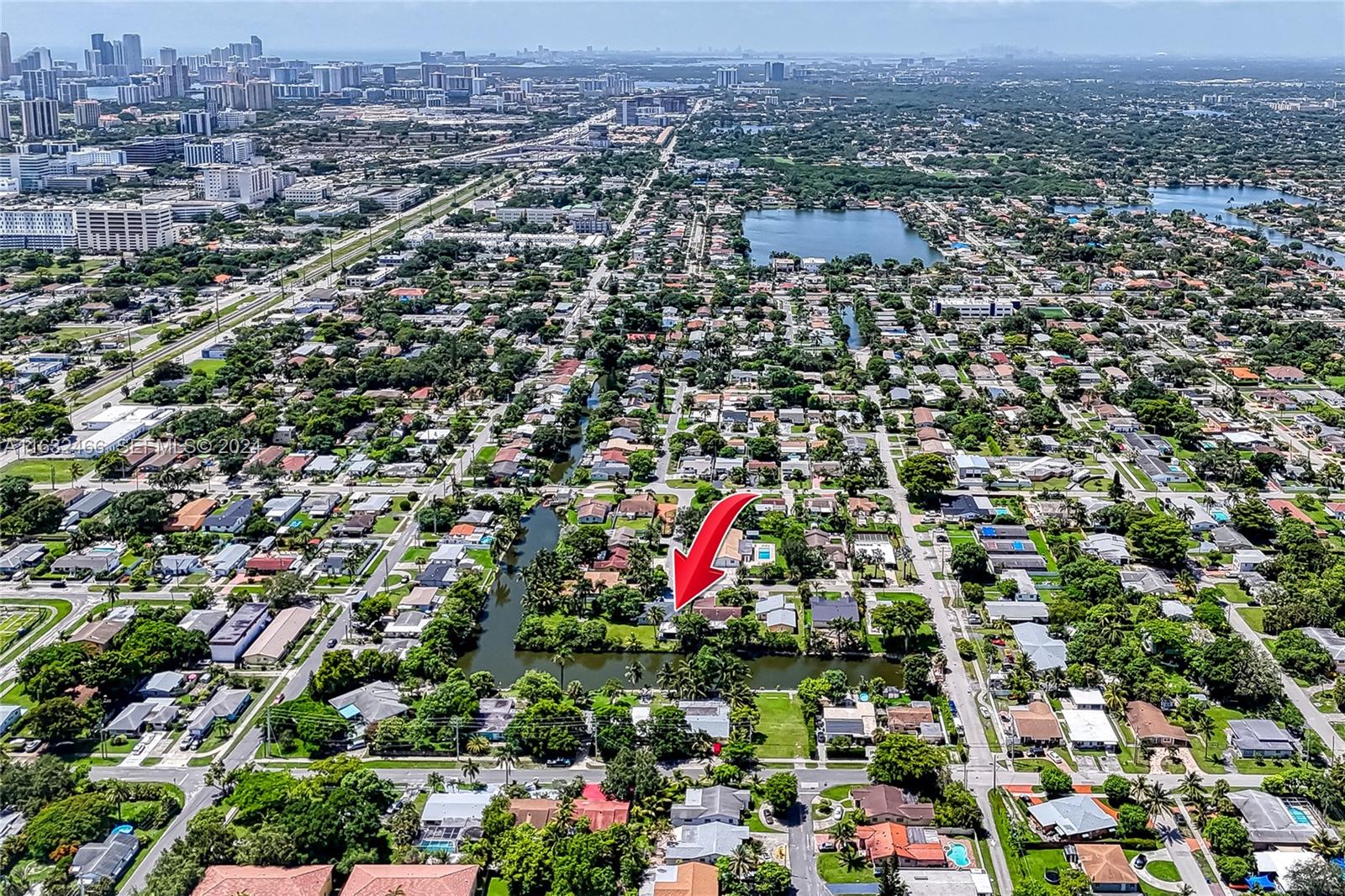 216 Southwest 6th Street Hallandale Beach, FL 33009 - Photo 58 of 70 an aerial view of residential houses with outdoor space and trees