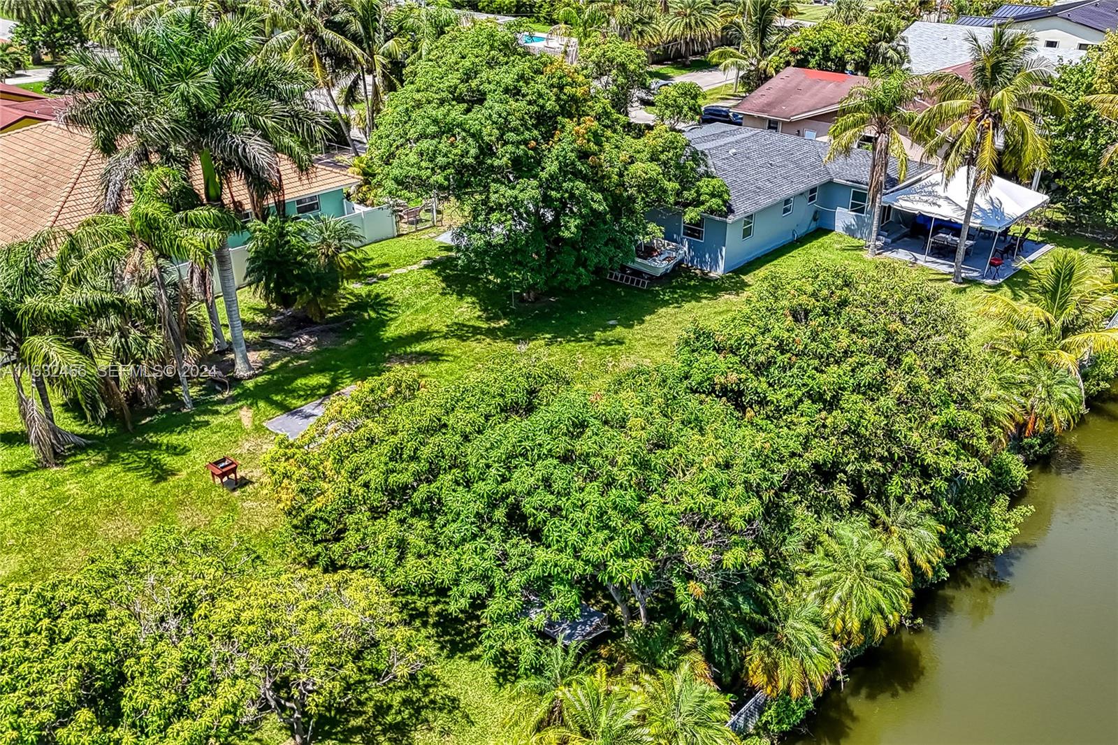 216 Southwest 6th Street Hallandale Beach, FL 33009 - Photo 65 of 70 an aerial view of residential house with outdoor space and trees all around