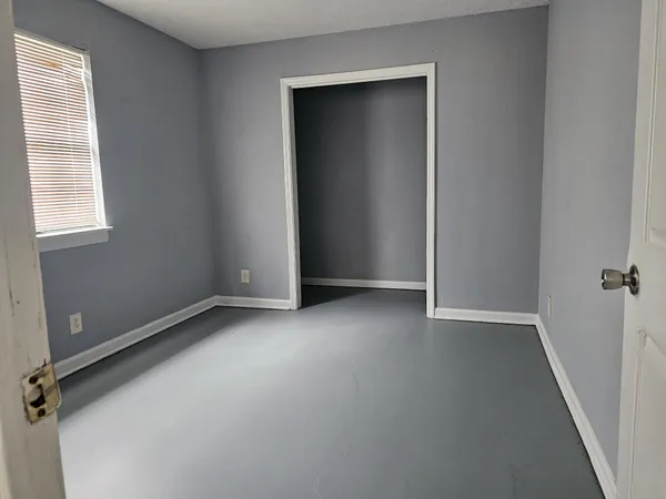 an empty room with windows