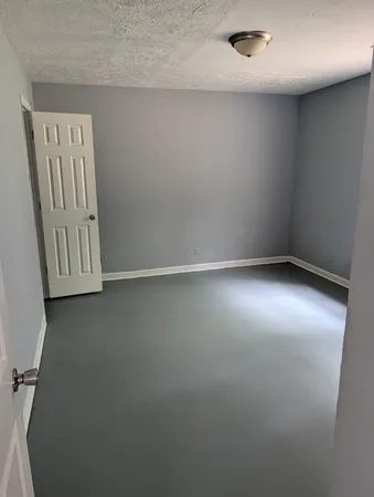 a room with a wall and mirror