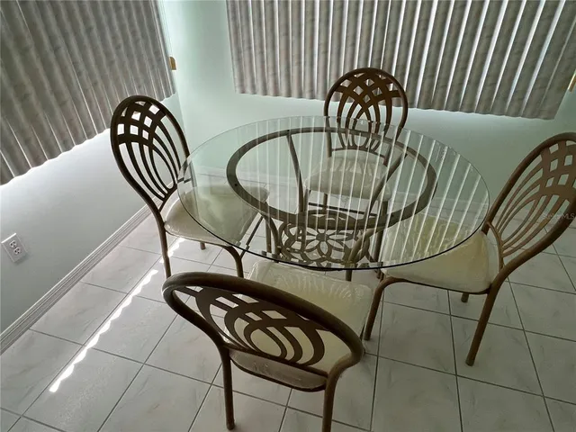 a view of a balcony with chairs