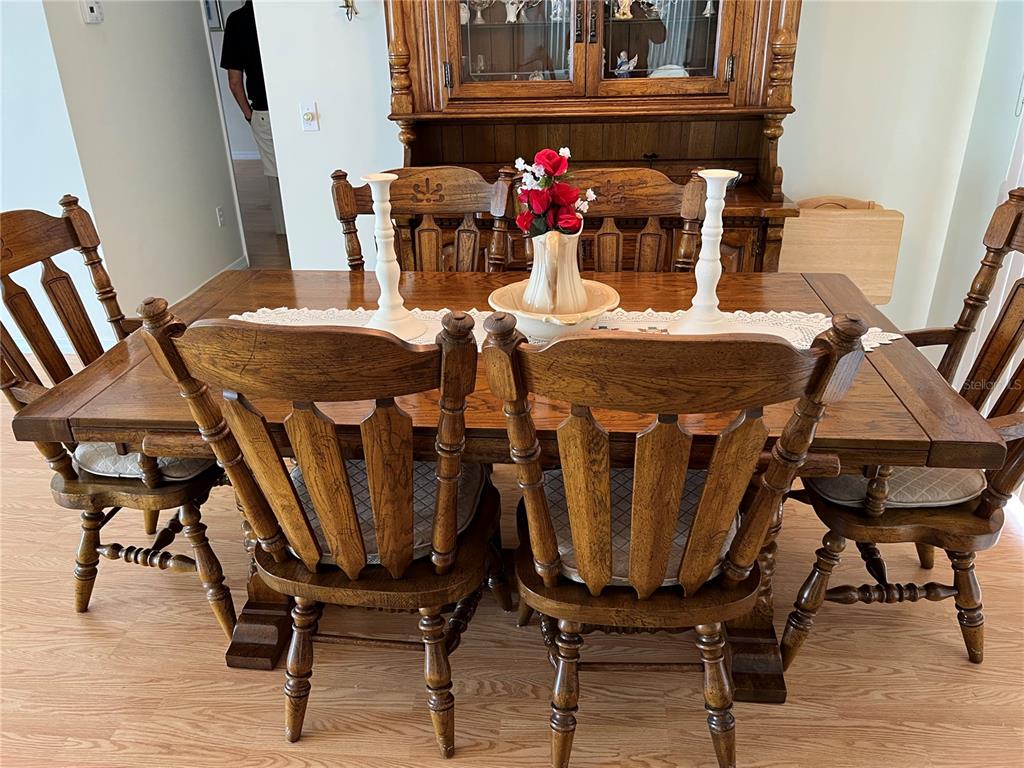 1232 Zapata Place Lady Lake, FL 32159 - Photo 5 of 10 a view of a dining room with furniture and wooden floor