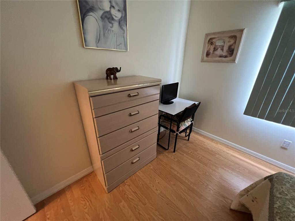 1232 Zapata Place Lady Lake, FL 32159 - Photo 10 of 10 a bedroom with a bed and a desk