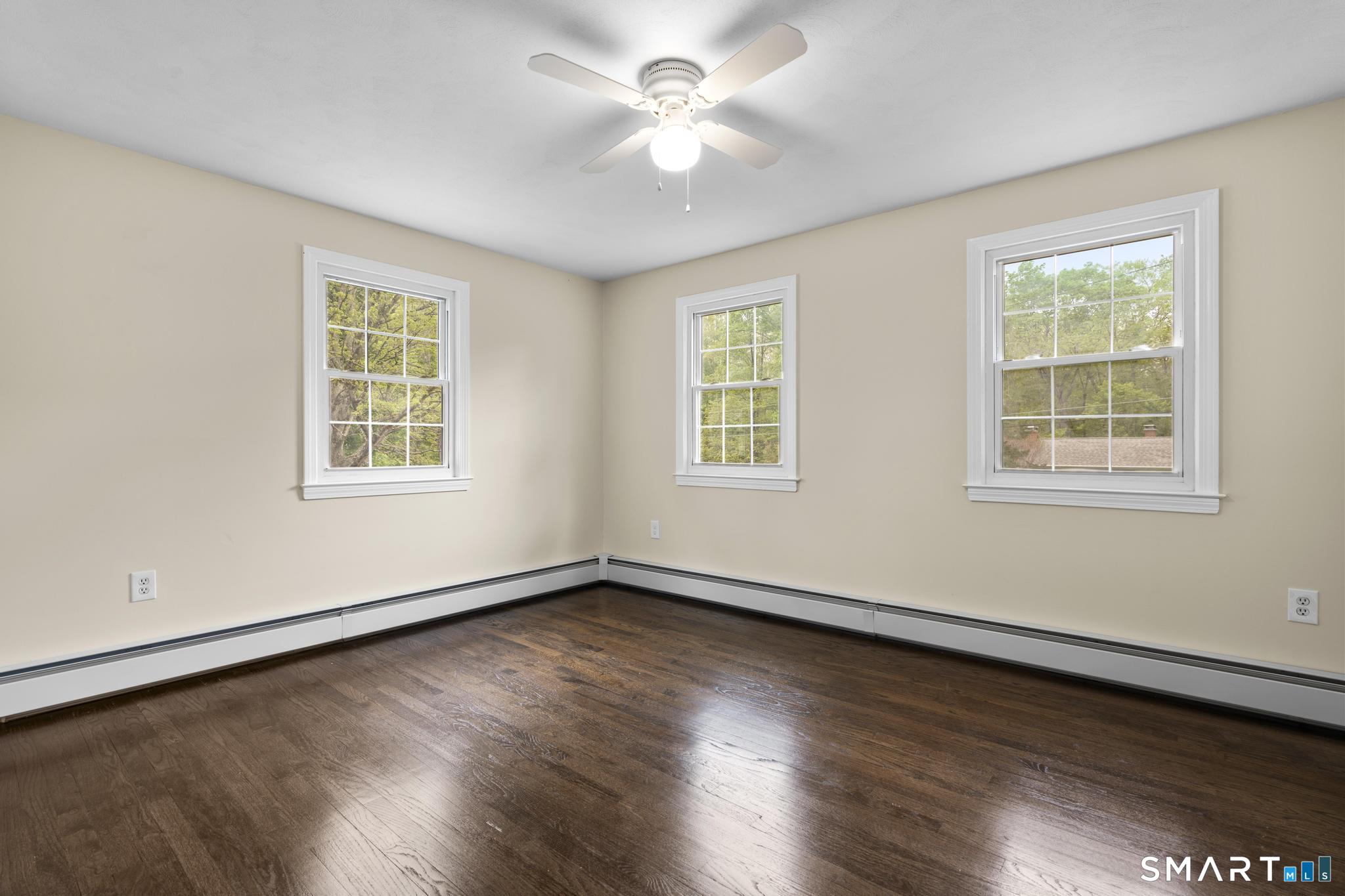 7 Sycamore Terrace Windham, CT 06280 - Photo 25 of 40 a view of an empty room with wooden floor and a window