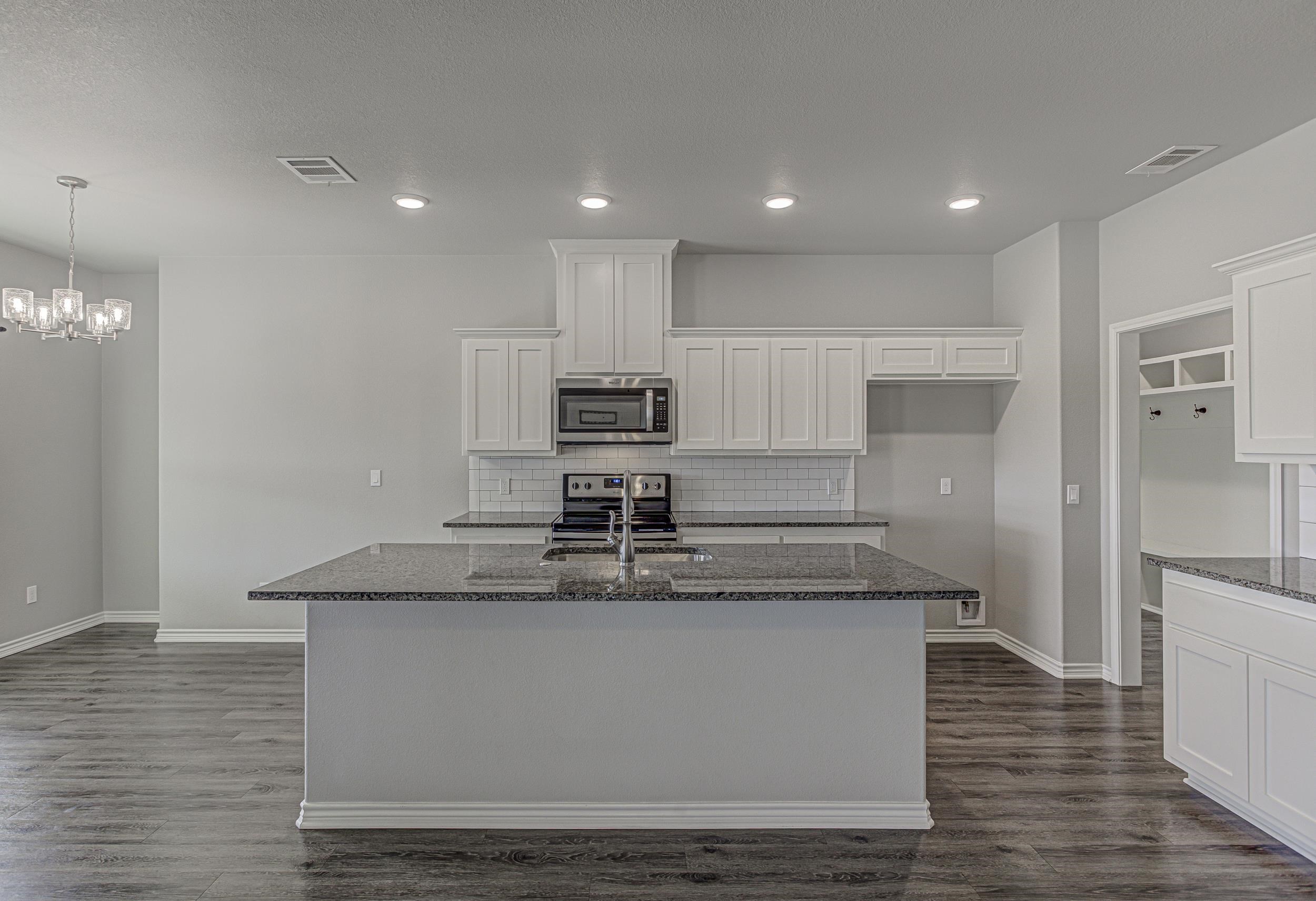 141 Rylee Road Burnet, TX 78611 - Photo 11 of 26 a large kitchen with stainless steel appliances granite countertop a granite counter tops and a large window