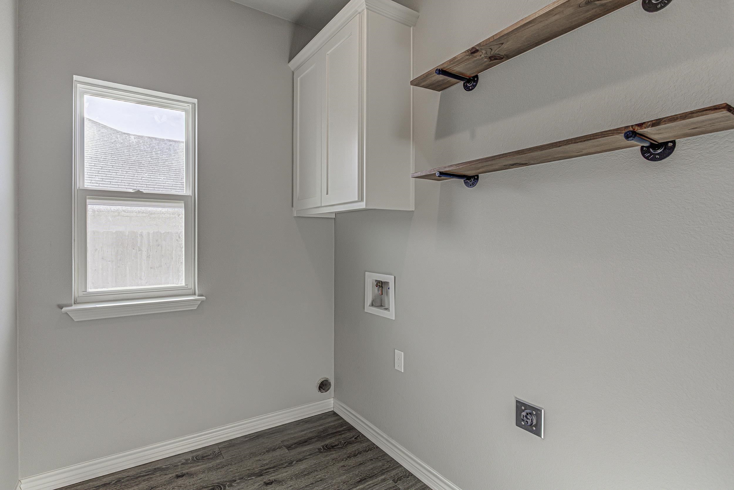 141 Rylee Road Burnet, TX 78611 - Photo 18 of 26 a view of a room with rack on the wall