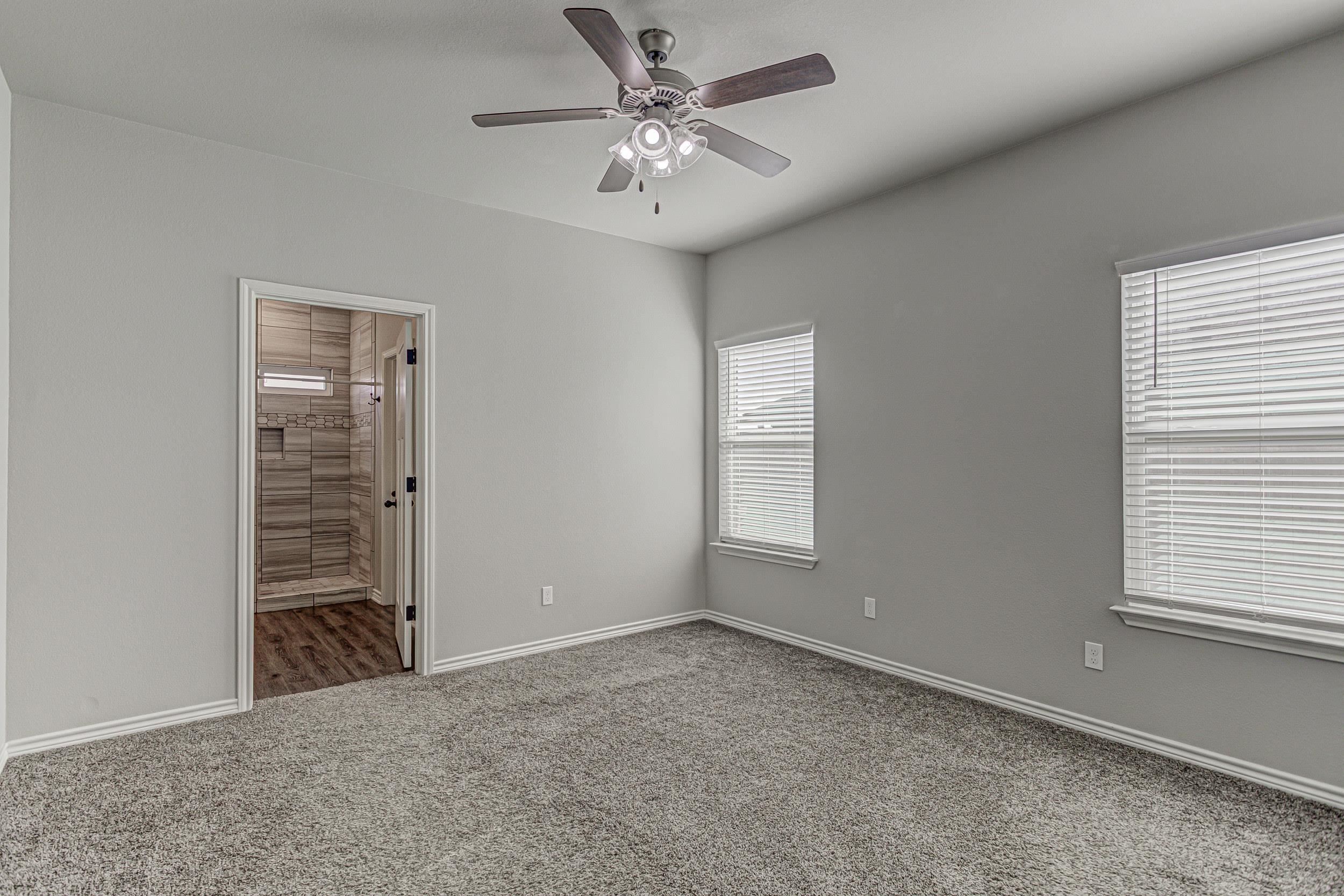 141 Rylee Road Burnet, TX 78611 - Photo 19 of 26 a view of an empty room with a window
